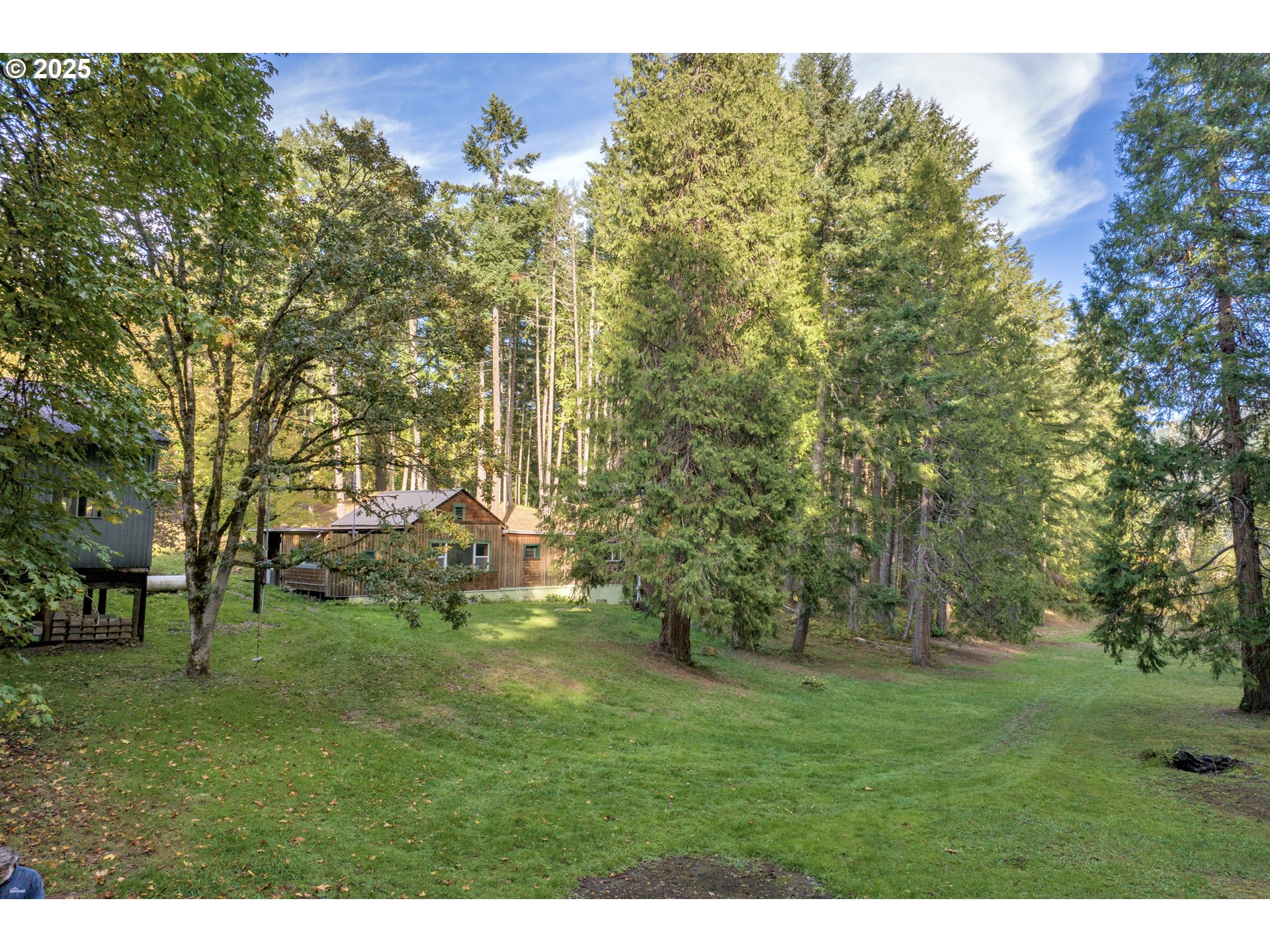 a backyard of a house with lots of green space