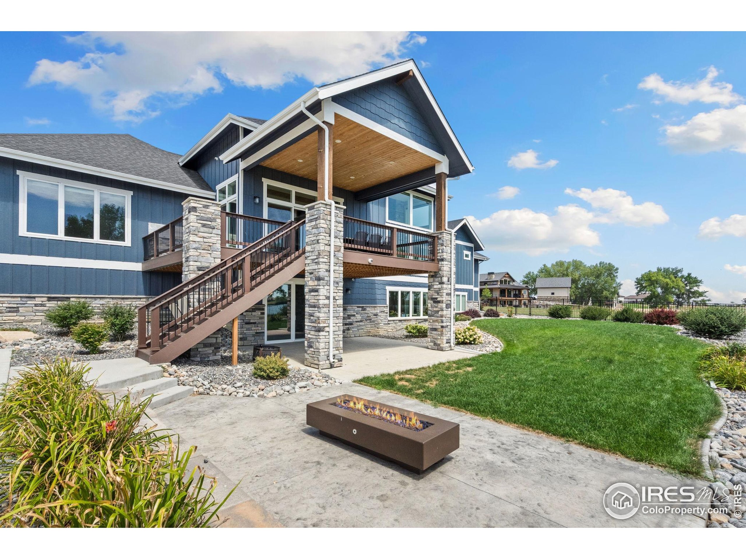 3324 Fox Crossing Place Loveland, CO 80537 - Photo 11 of 47 a aerial view of a house with swimming pool and porch