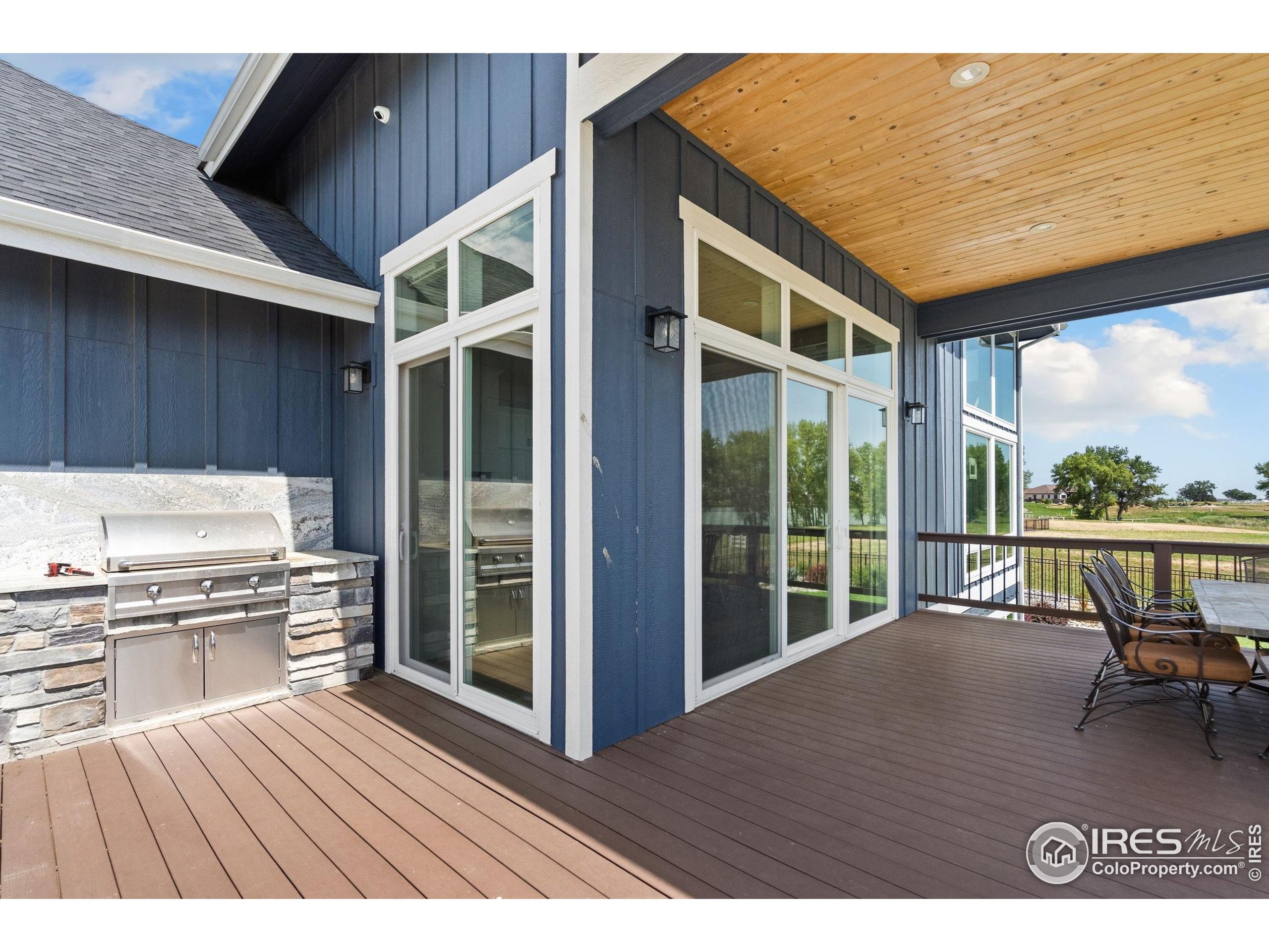 3324 Fox Crossing Place Loveland, CO 80537 - Photo 13 of 47 a view of a house with a deck