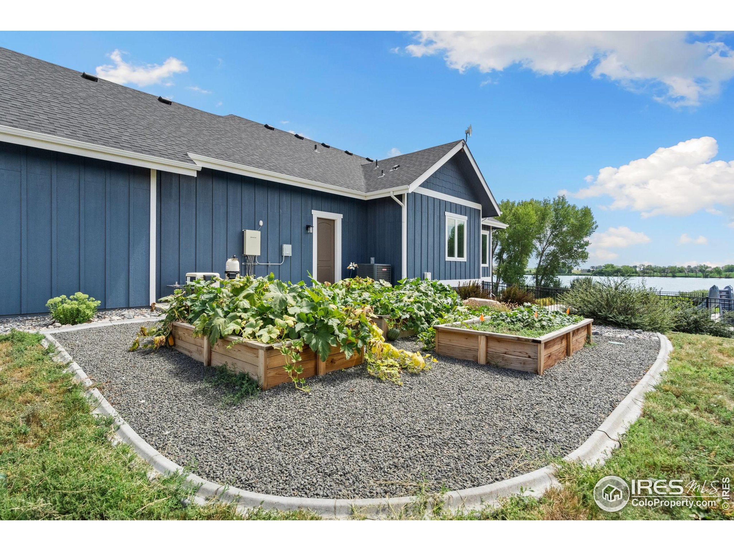 3324 Fox Crossing Place Loveland, CO 80537 - Photo 15 of 47 a view of a house with garden and plants