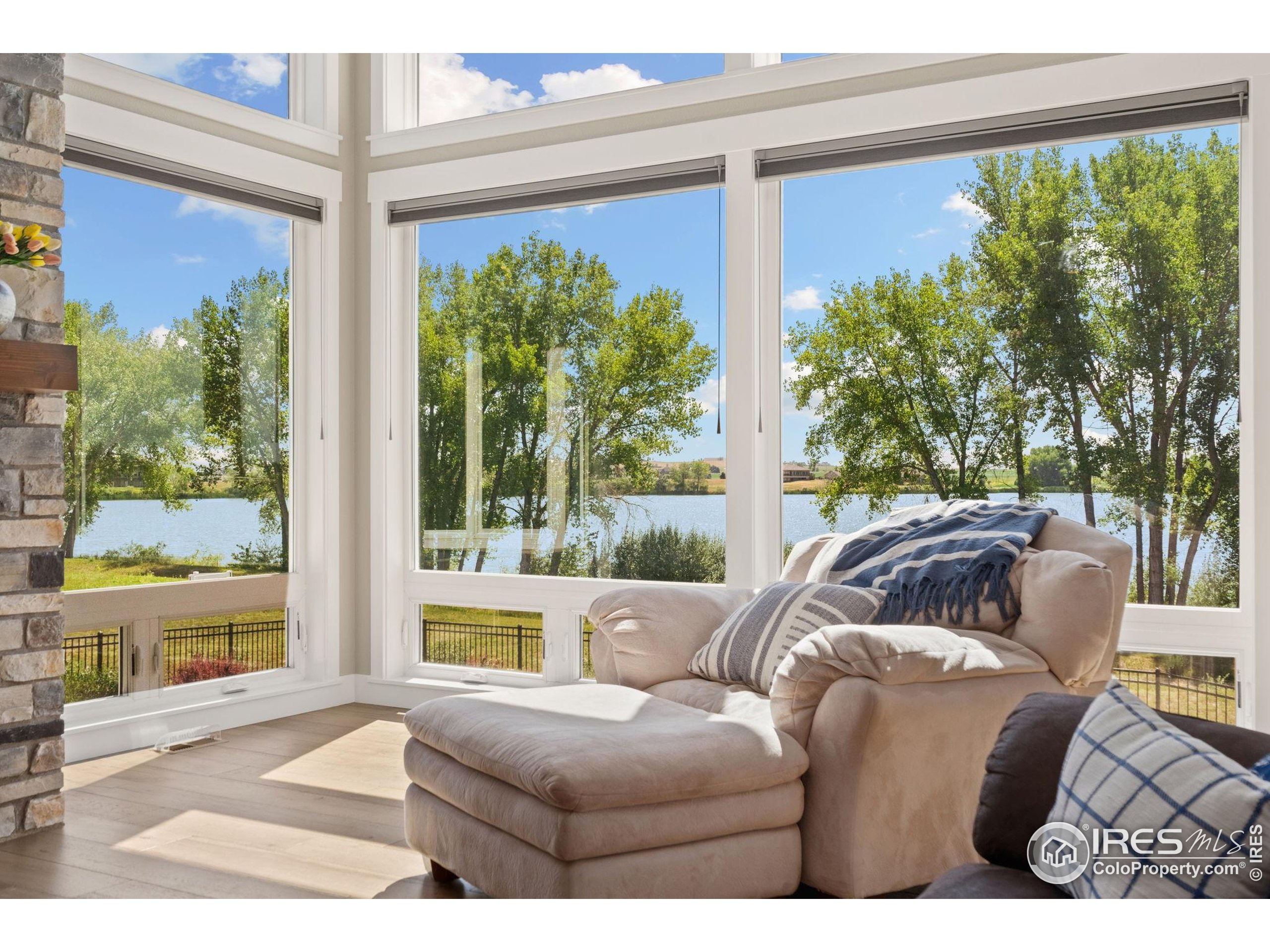 3324 Fox Crossing Place Loveland, CO 80537 - Photo 18 of 47 a living room with furniture and a large window