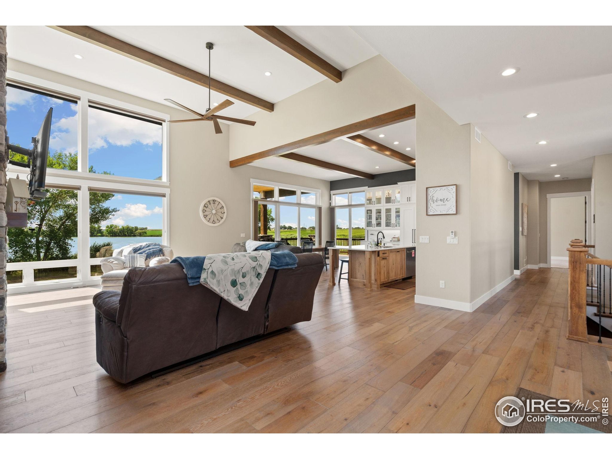 3324 Fox Crossing Place Loveland, CO 80537 - Photo 20 of 47 a living room with furniture and a large window