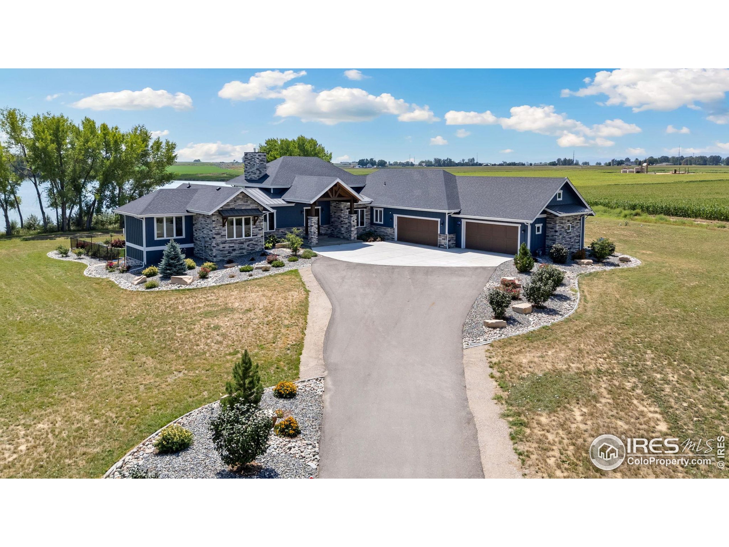 3324 Fox Crossing Place Loveland, CO 80537 - Photo 2 of 47 a balcony with furniture and city view