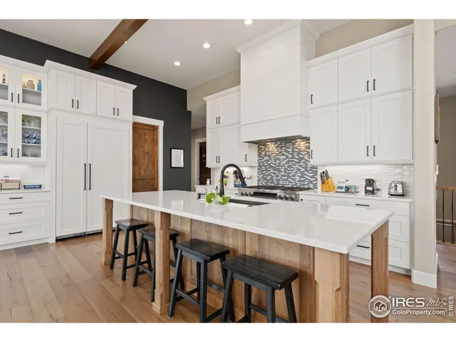 a dining room with furniture window and wooden floor