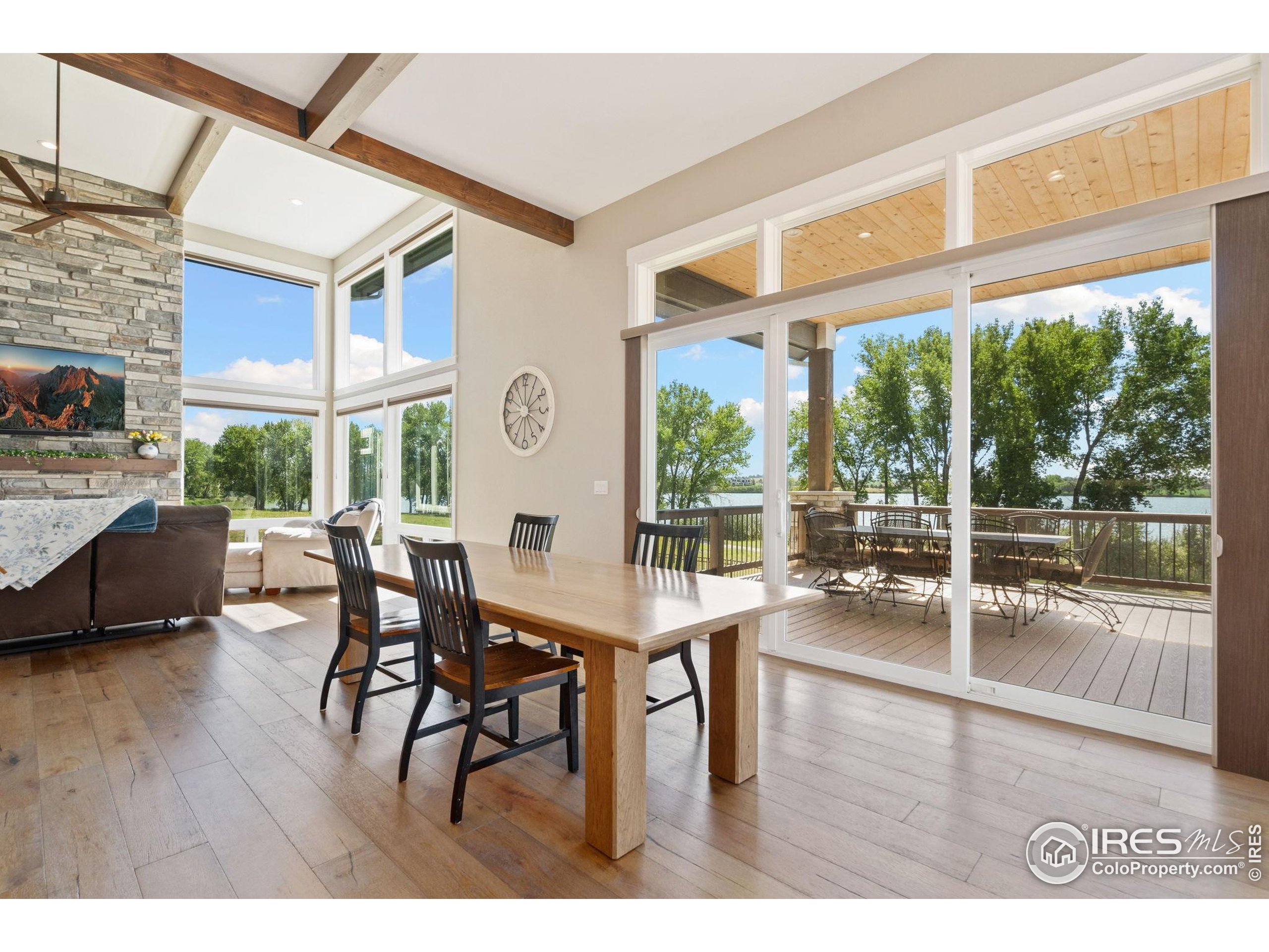 3324 Fox Crossing Place Loveland, CO 80537 - Photo 25 of 47 a dining room with furniture window and wooden floor