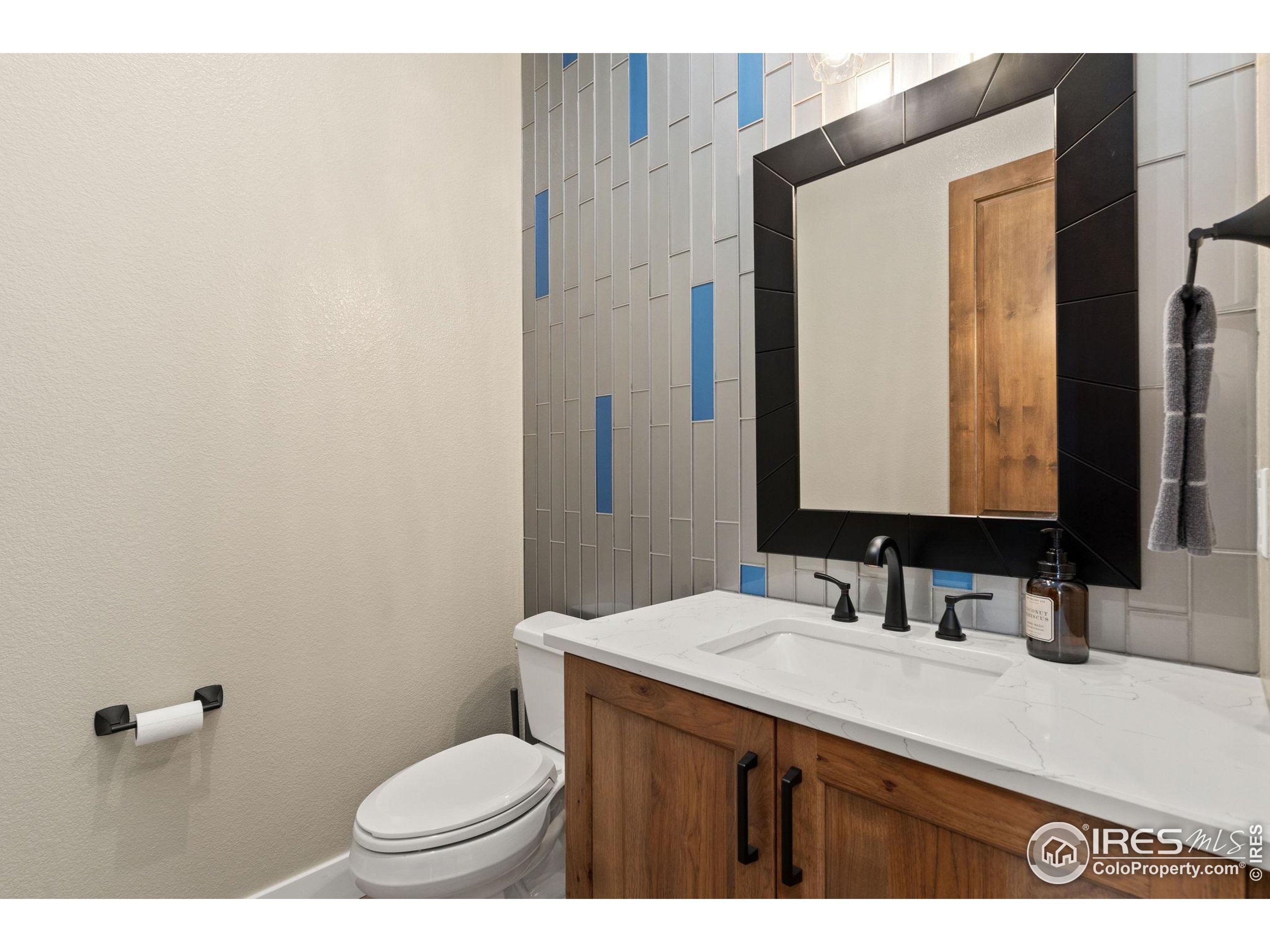 3324 Fox Crossing Place Loveland, CO 80537 - Photo 28 of 47 a bathroom with a sink and a mirror