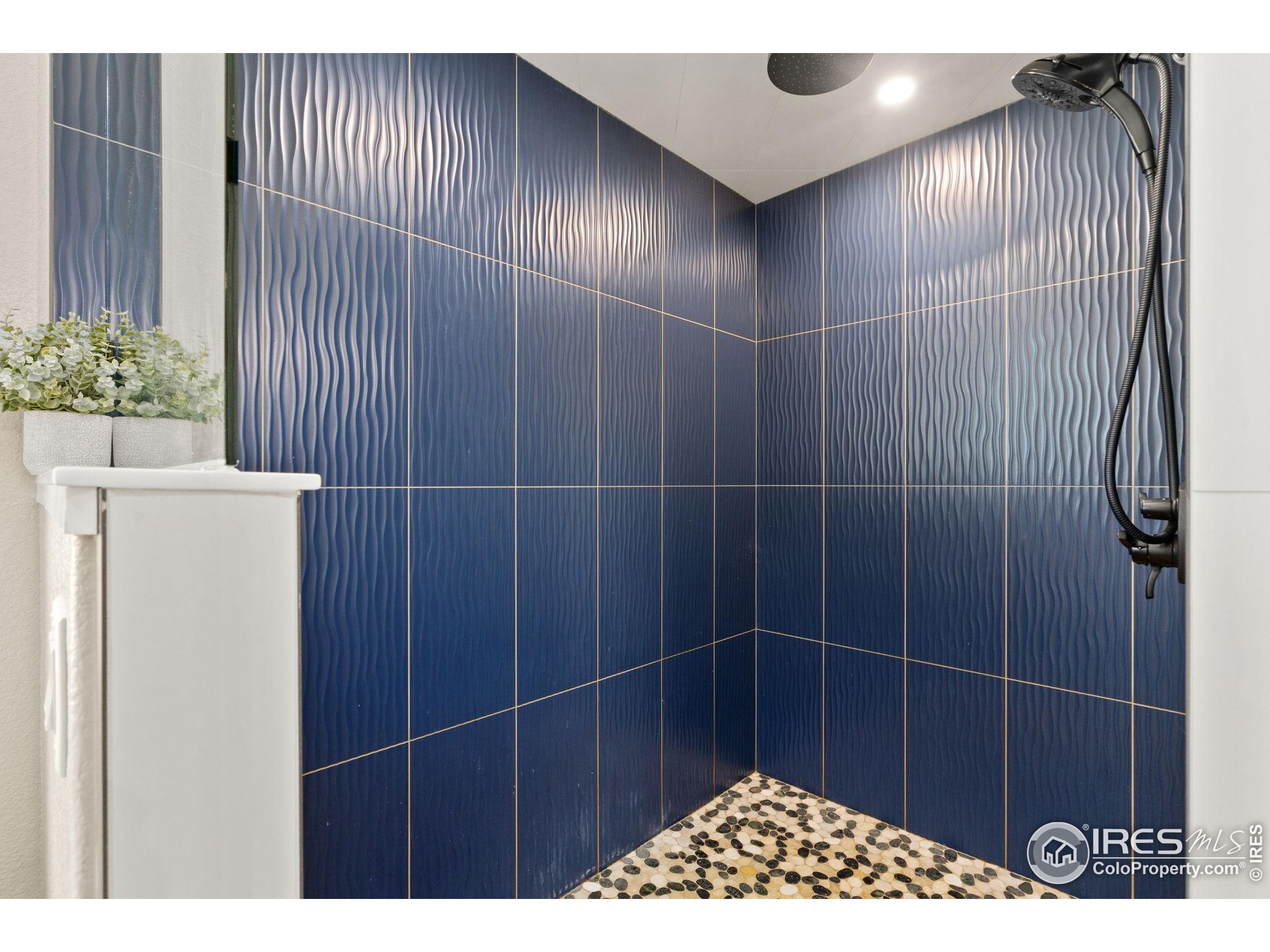 3324 Fox Crossing Place Loveland, CO 80537 - Photo 32 of 47 a bathroom with a shower and a sink