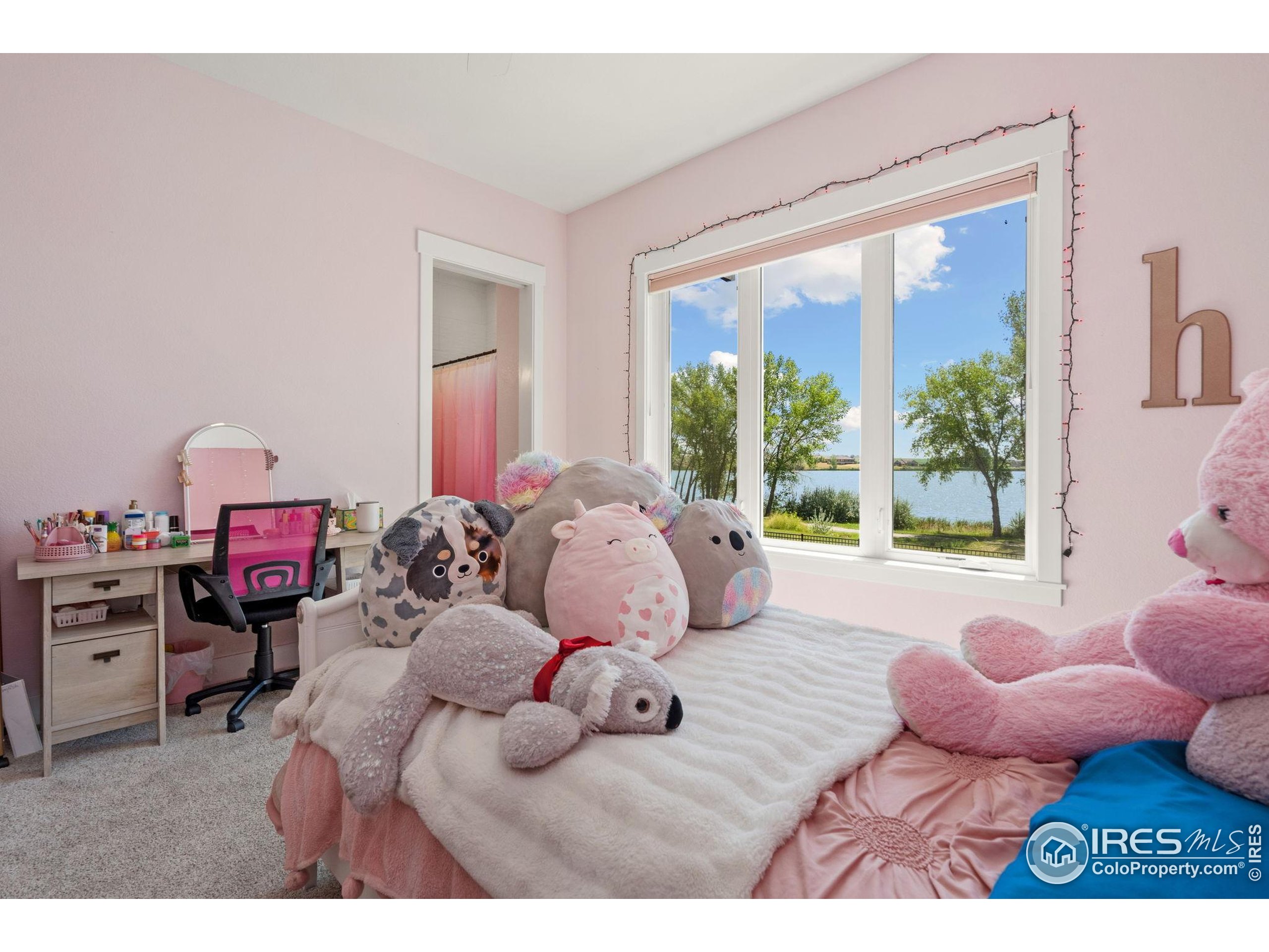 3324 Fox Crossing Place Loveland, CO 80537 - Photo 35 of 47 a bedroom with furniture and a large window