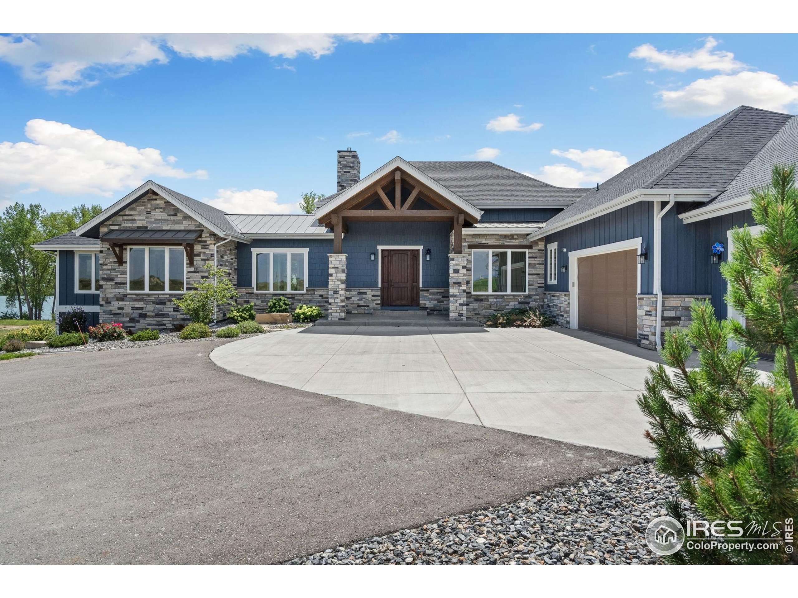 3324 Fox Crossing Place Loveland, CO 80537 - Photo 4 of 47 a front view of a house with a yard