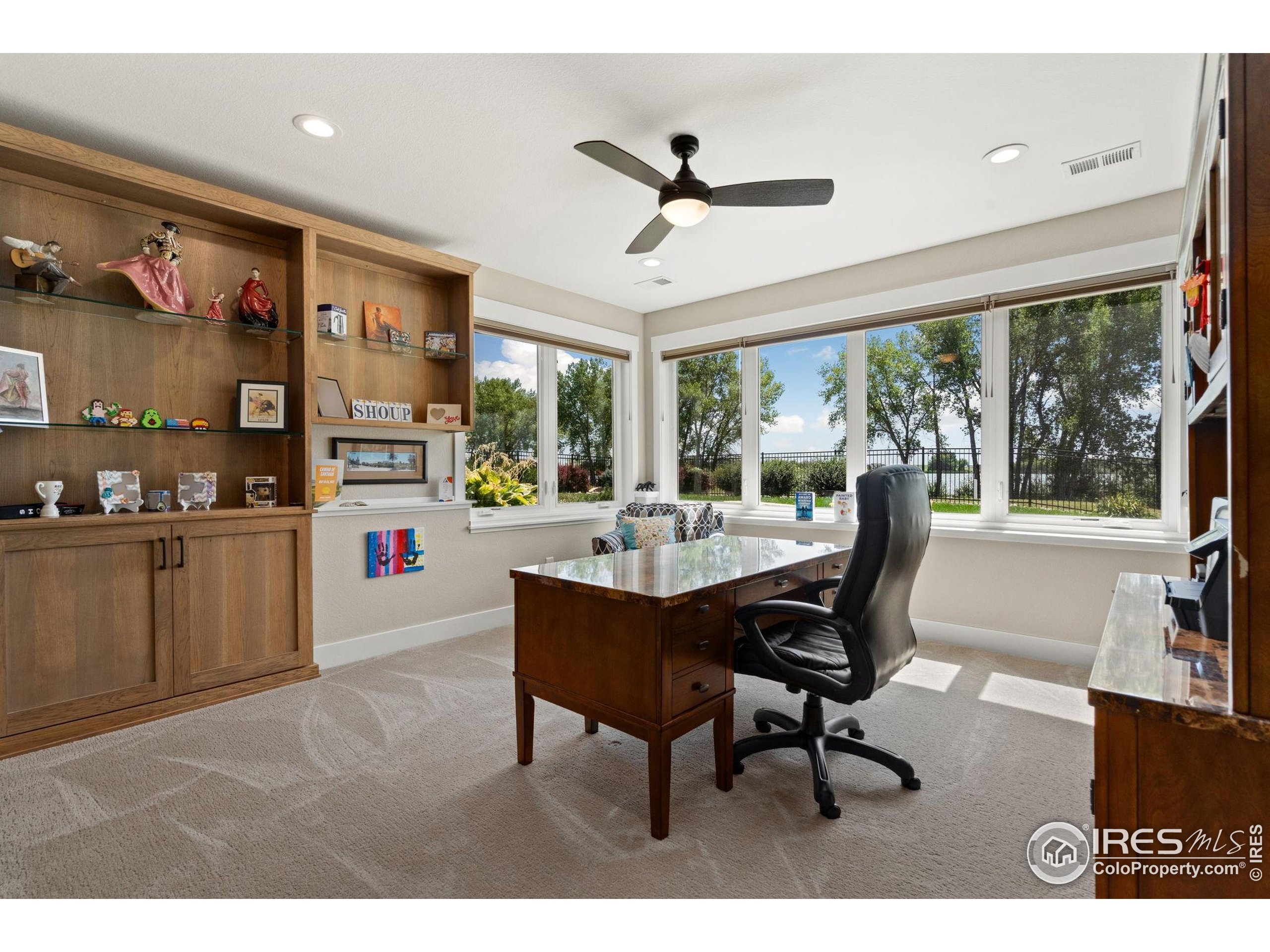 3324 Fox Crossing Place Loveland, CO 80537 - Photo 42 of 47 a view of a dining room with furniture window and outside view