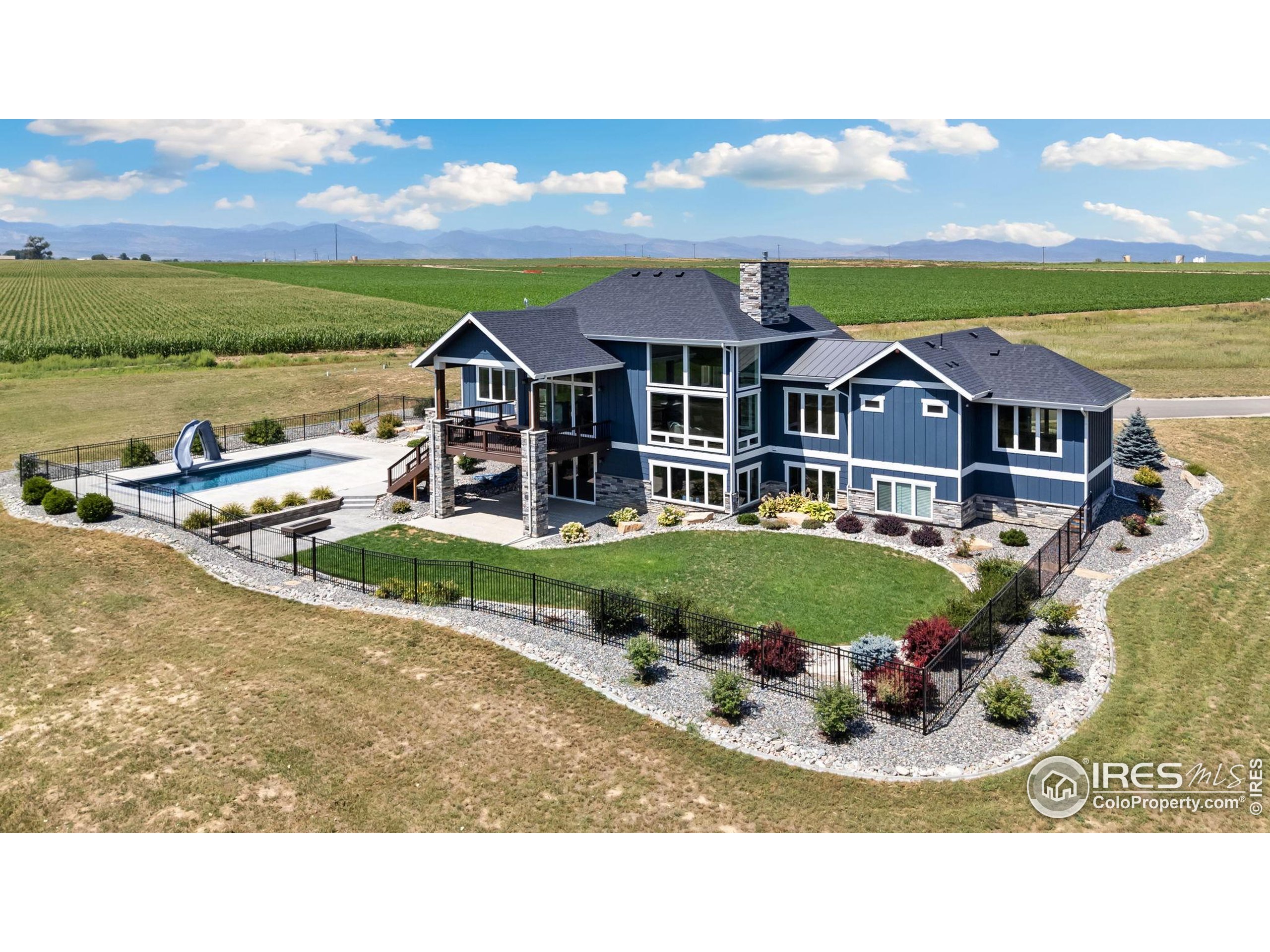 3324 Fox Crossing Place Loveland, CO 80537 - Photo 6 of 47 a view of a house with a garden