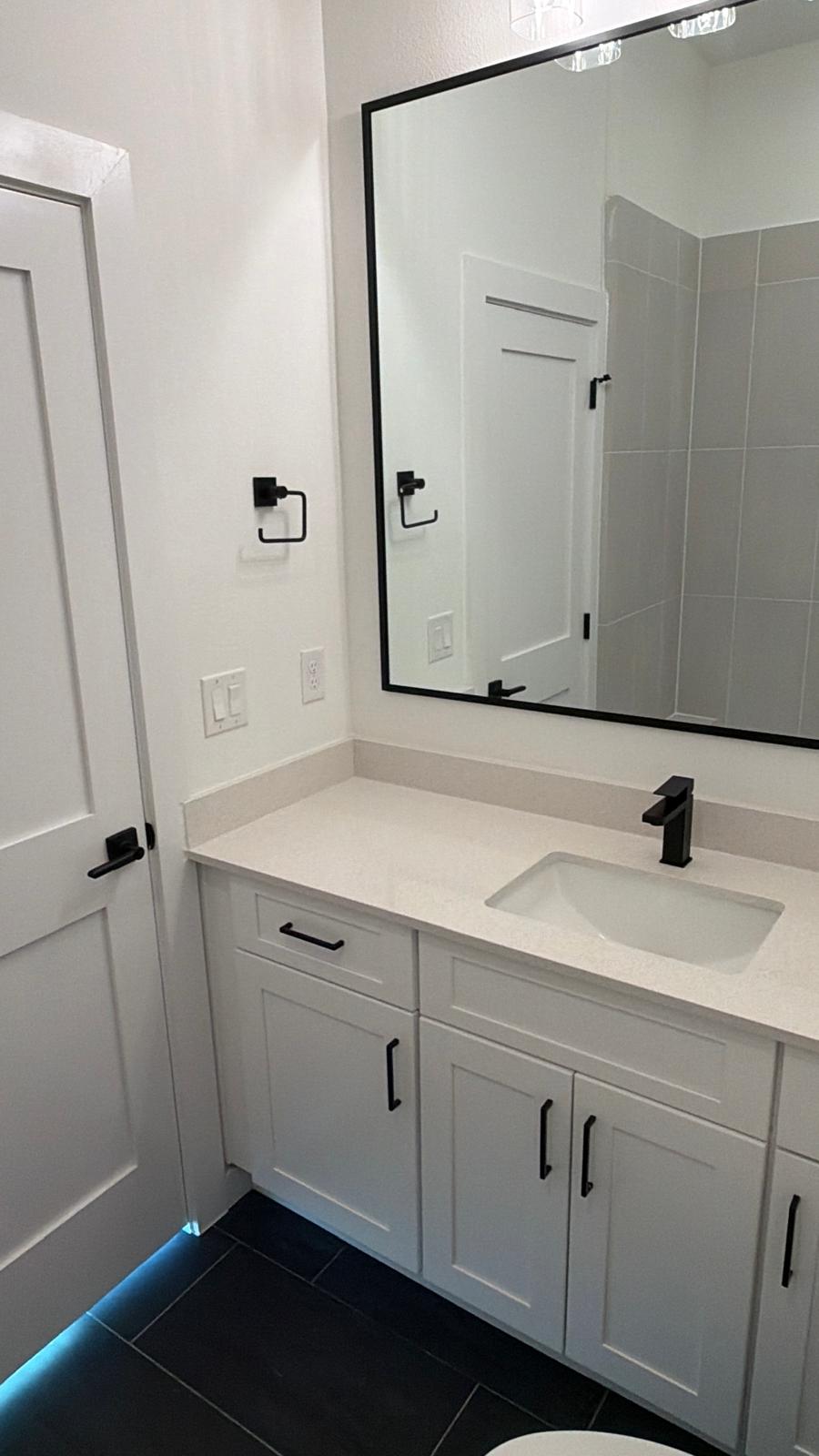 2000 Riverside Farms Road, Unit 12101 Austin, TX 78741 - Photo 30 of 33 Crisp finishes and dark tile flooring create a contemporary look in this bathroom.