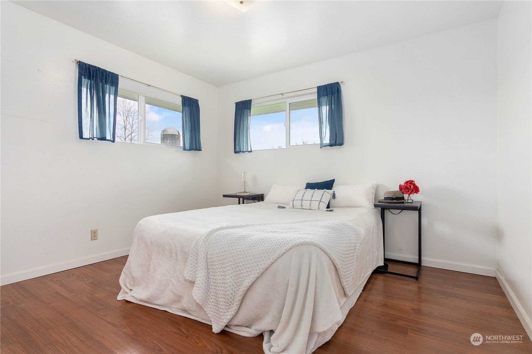 8134 Kickerville Road Custer, WA 98240 - Photo 11 of 33 a bedroom with a bed and a chandelier