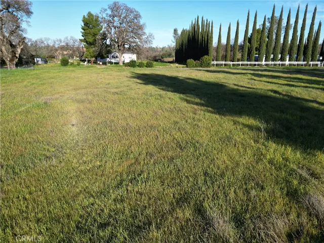 a view of a lake with houses in the back