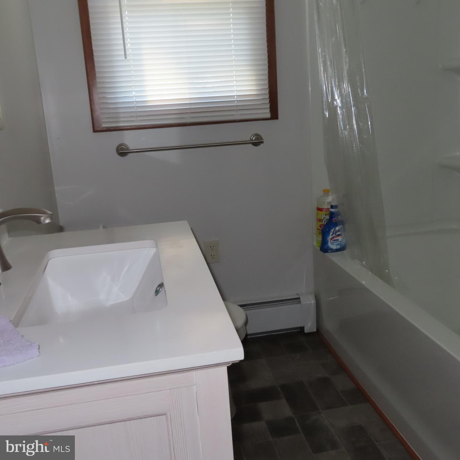 1126 Crottlestown Road Chambersburg, PA 17202 - Photo 16 of 47 a bathroom with a sink and bathtub
