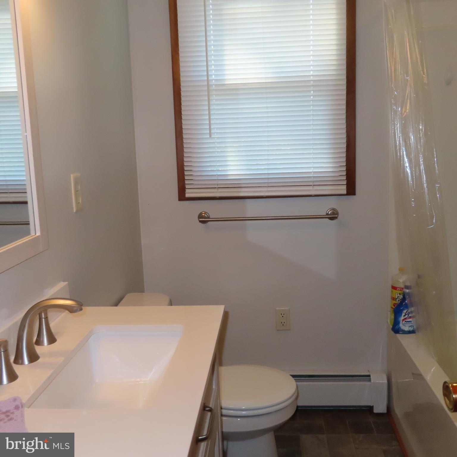 1126 Crottlestown Road Chambersburg, PA 17202 - Photo 18 of 47 a bathroom with a sink a toilet and a window