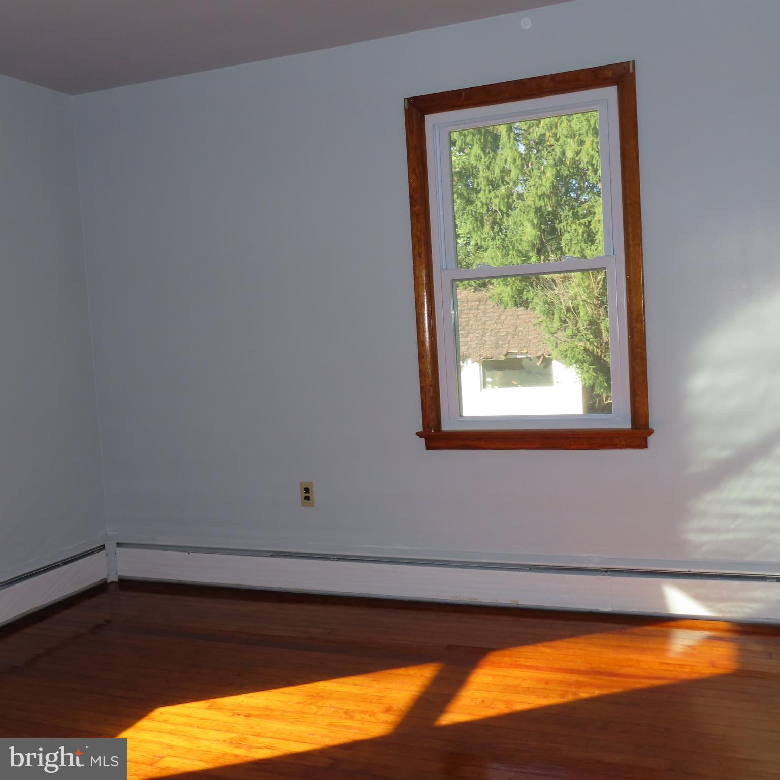 1126 Crottlestown Road Chambersburg, PA 17202 - Photo 20 of 47 a view of a room with wooden floor and a window