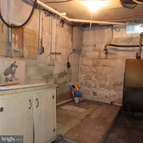 a bathroom with a shower and a sink