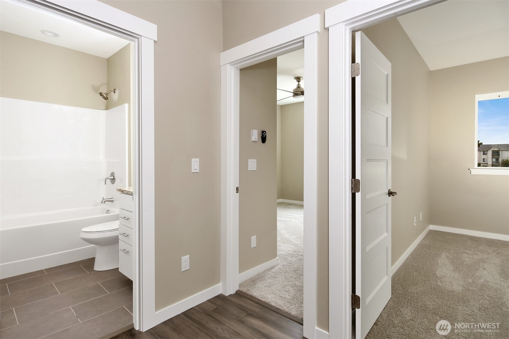1515 North Waugh Road, Unit A Mount Vernon, WA 98273 - Photo 18 of 28 a bathroom with a granite countertop toilet a sink and shower