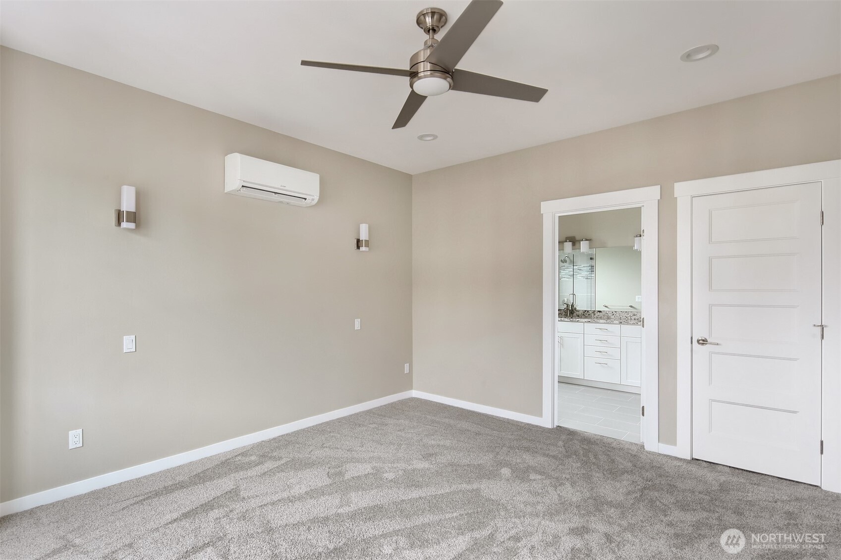 1515 North Waugh Road, Unit A Mount Vernon, WA 98273 - Photo 23 of 28 a view of a room with a ceiling fan and carpet