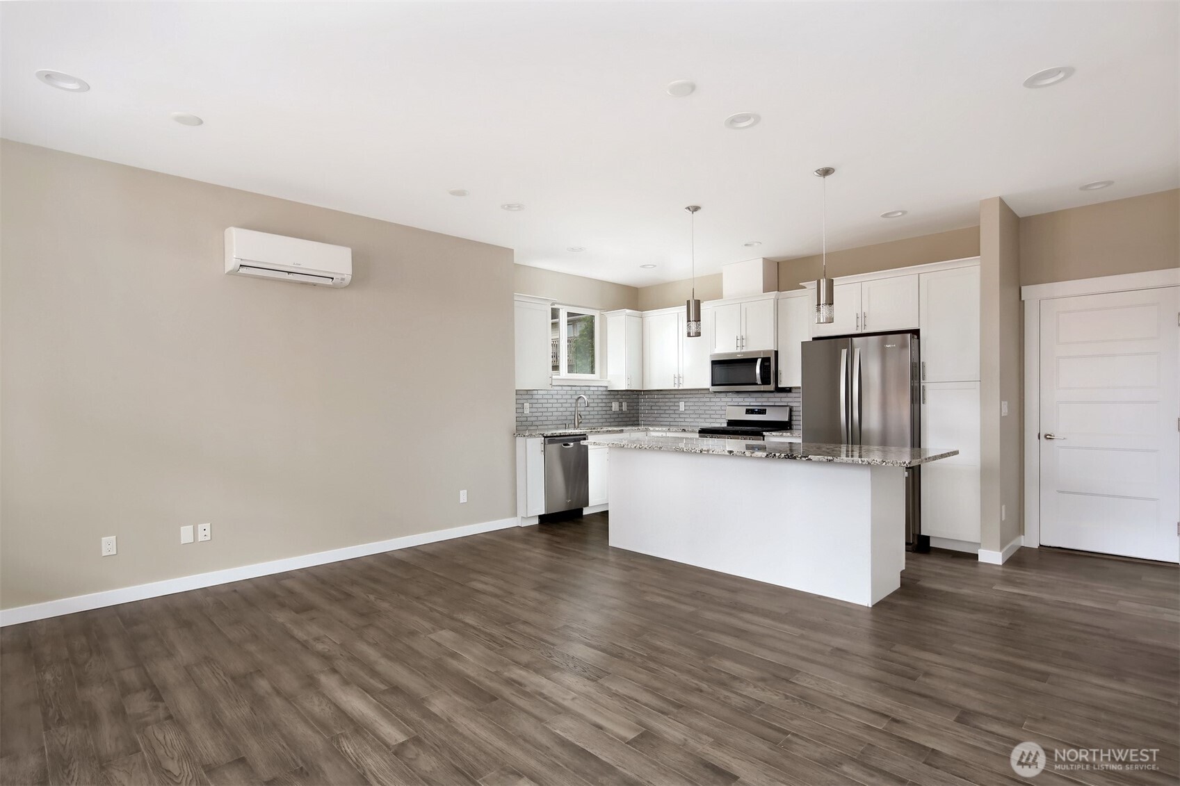 1515 North Waugh Road, Unit A Mount Vernon, WA 98273 - Photo 3 of 28 a kitchen with stainless steel appliances a refrigerator sink and white cabinets