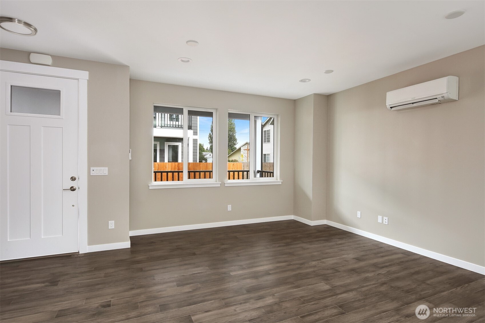 1515 North Waugh Road, Unit A Mount Vernon, WA 98273 - Photo 5 of 28 a view of an empty room with wooden floor and a window