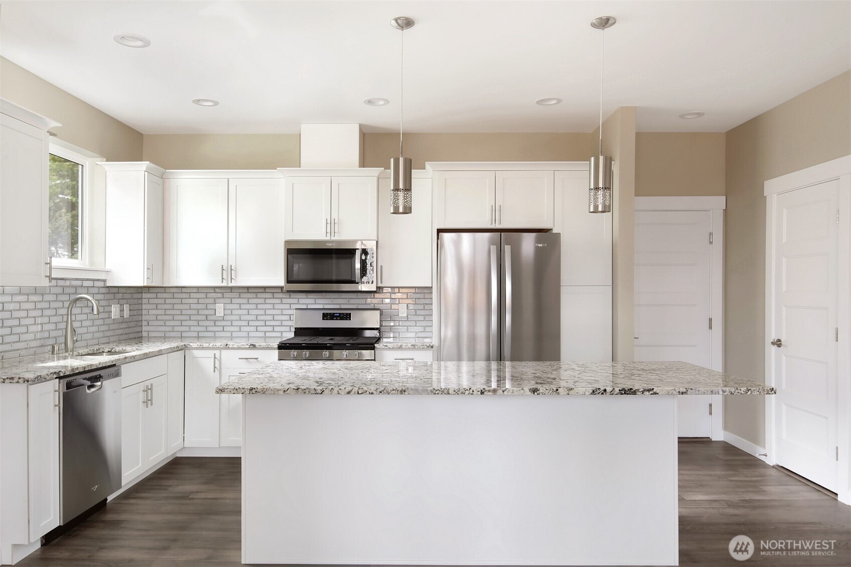 1515 North Waugh Road, Unit A Mount Vernon, WA 98273 - Photo 8 of 28 a kitchen with stainless steel appliances a refrigerator sink and microwave