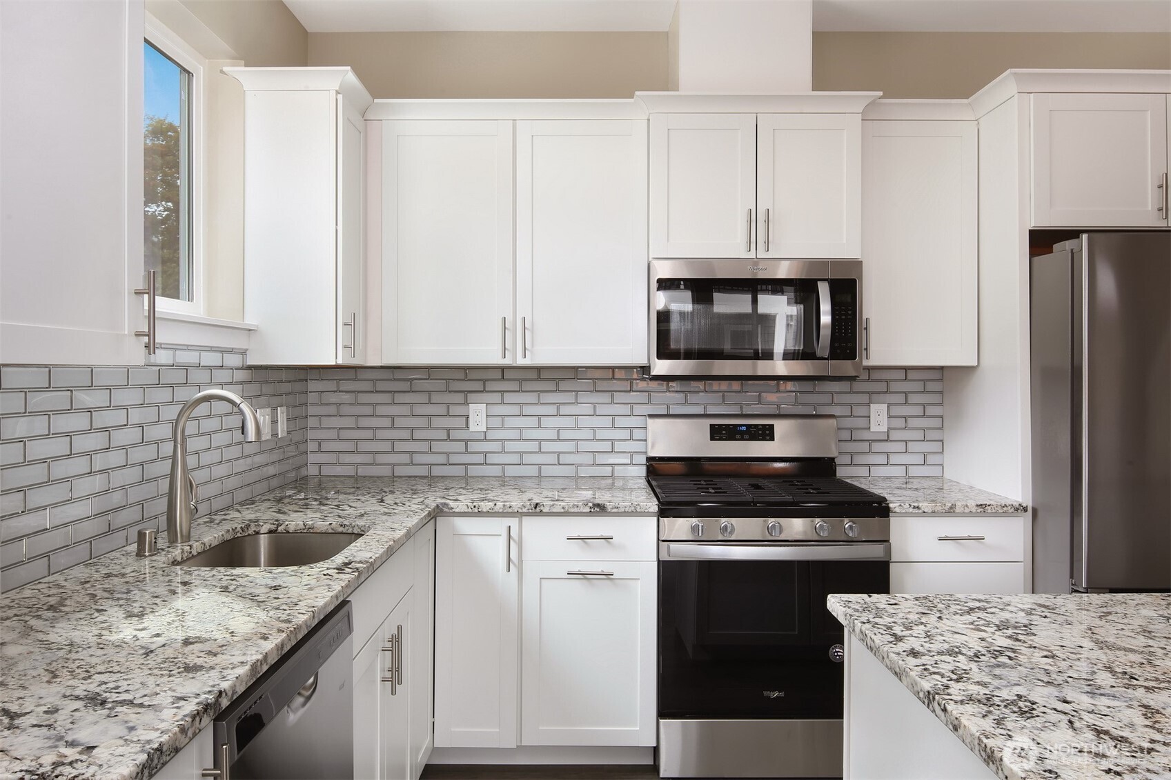 1515 North Waugh Road, Unit A Mount Vernon, WA 98273 - Photo 10 of 28 a kitchen with a sink stove and refrigerator