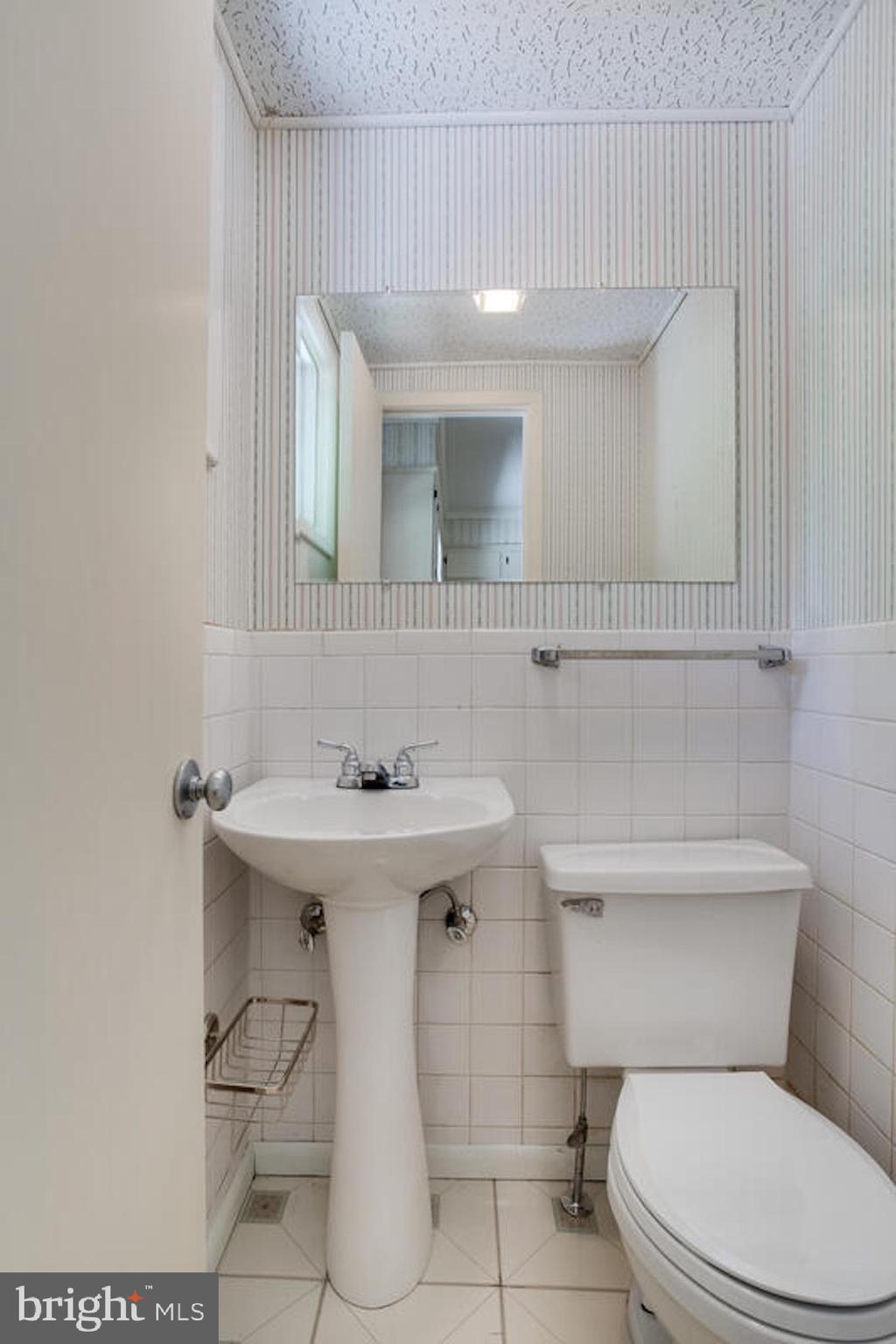 2645 Aspen Road Port Republic, MD 20676 - Photo 25 of 51 a bathroom with a sink a toilet and mirror