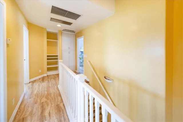 a bedroom with a bed and a television