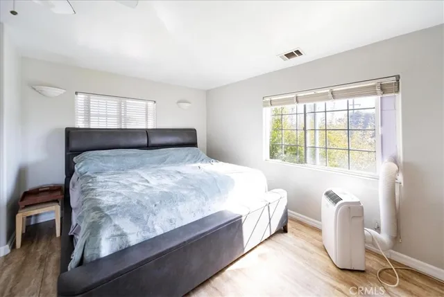 a spacious bathroom with a granite countertop sink and a mirror