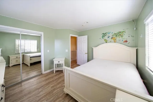 a view of an entryway with wooden floor