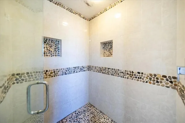 a view of a house with backyard and a tree