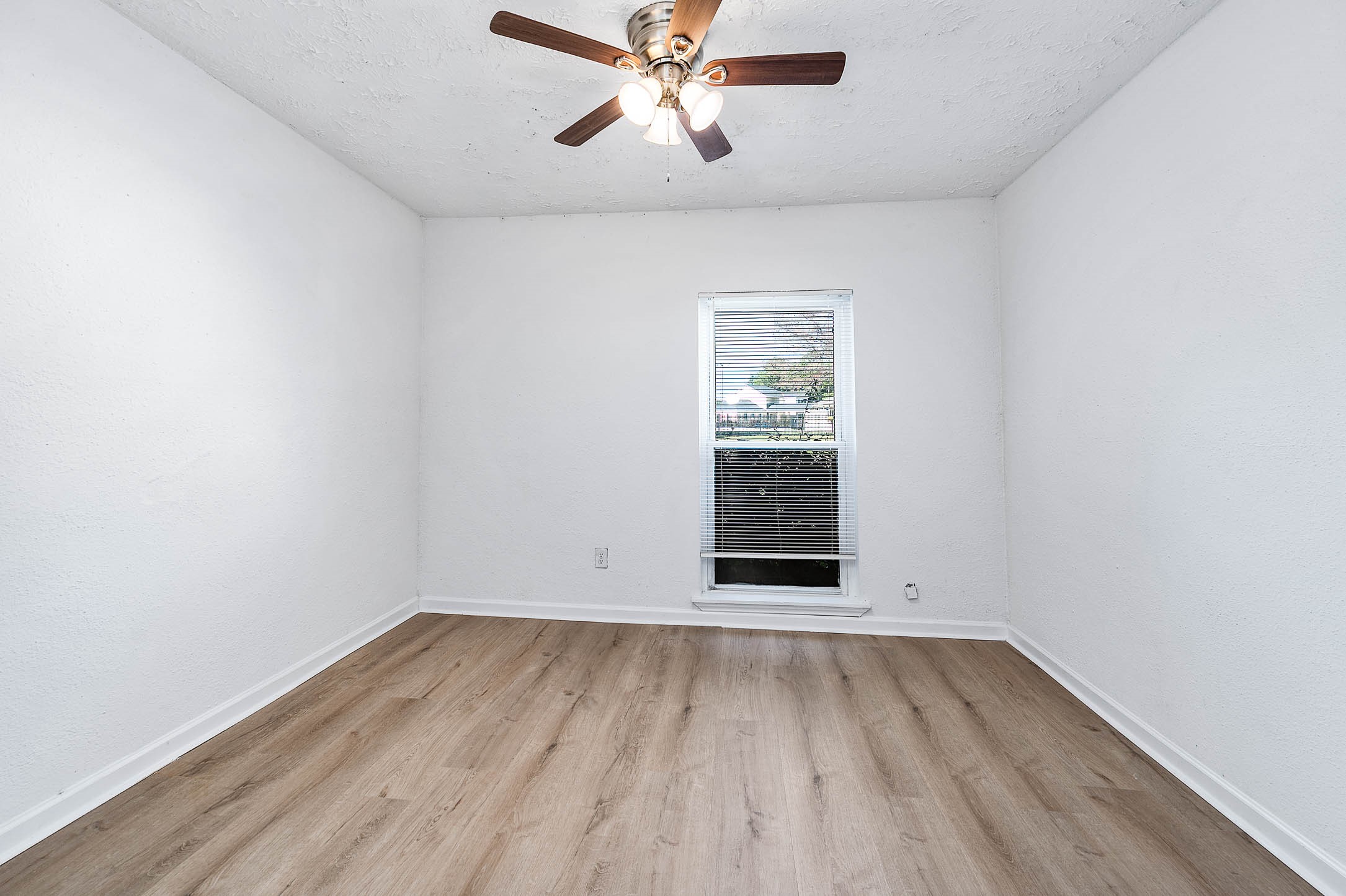 24007 Pepperrell Pl Street Katy, TX 77493 - Photo 15 of 24 an empty room with a window and ceiling fan