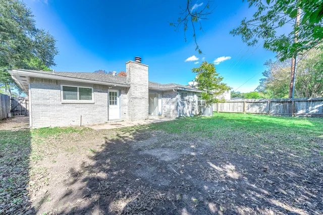 a house view with a backyard space