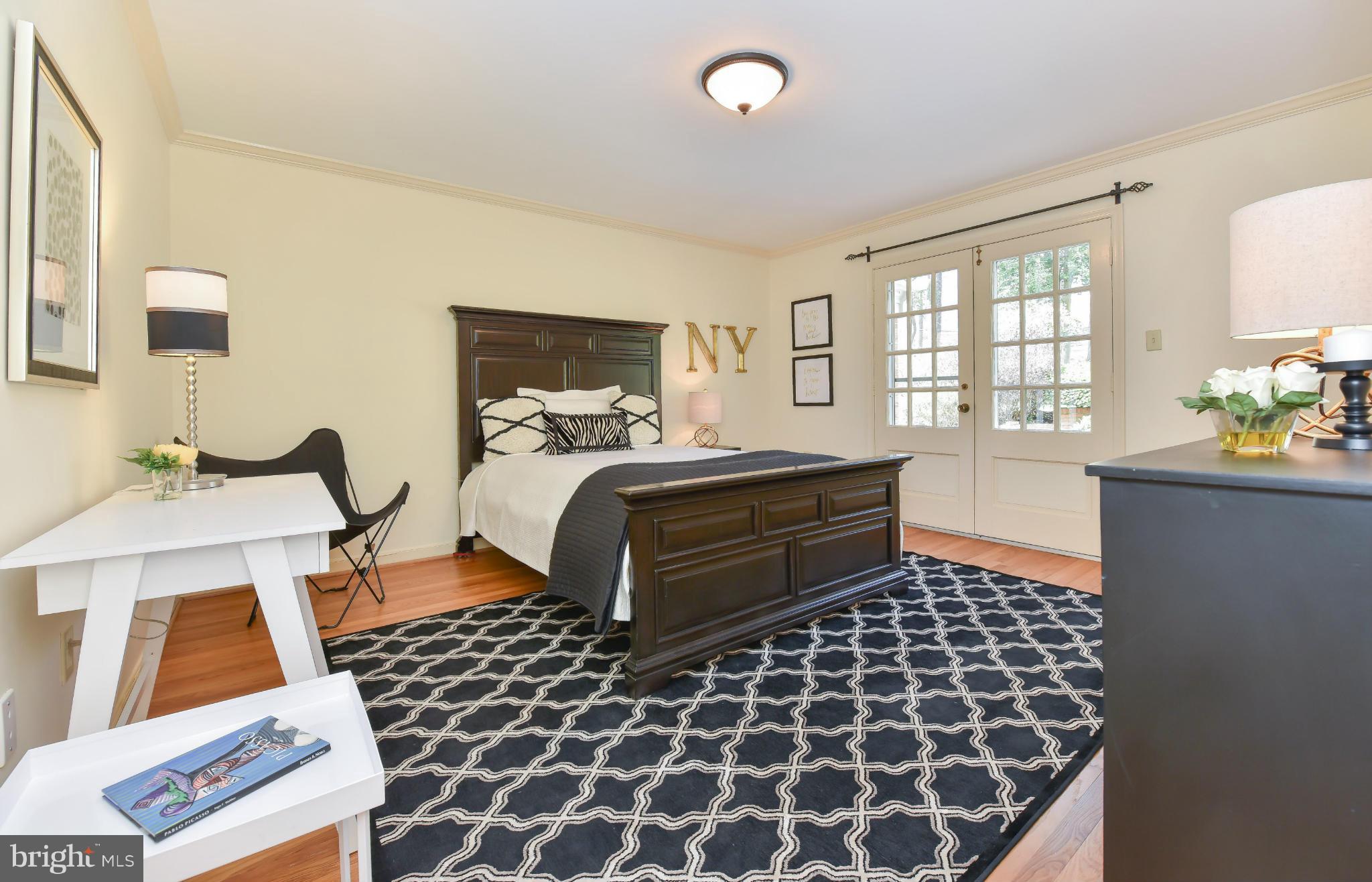 7704 Burford Drive McLean, VA 22102 - Photo 12 of 30 a bedroom with double bed and a window
