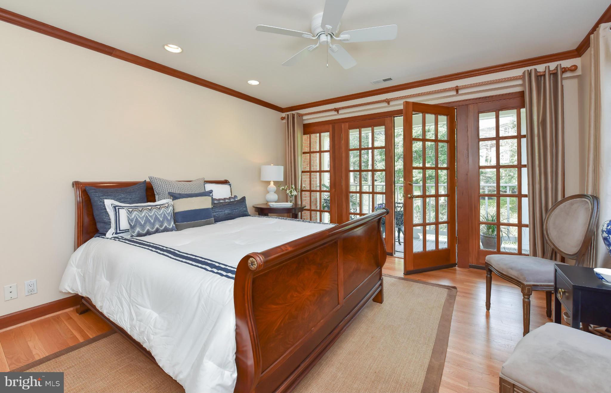 7704 Burford Drive McLean, VA 22102 - Photo 14 of 30 a bed room with a bed and a large window