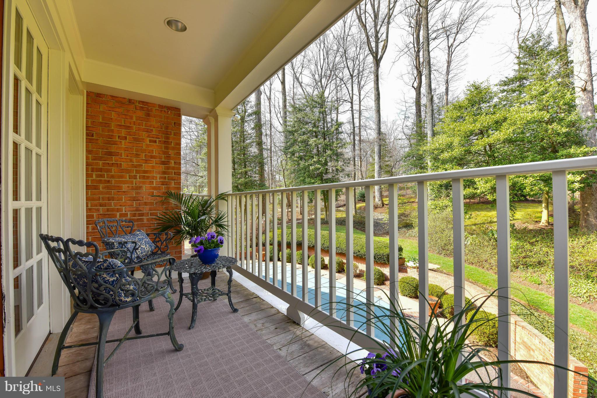7704 Burford Drive McLean, VA 22102 - Photo 16 of 30 a view of a porch with furniture and wooden deck
