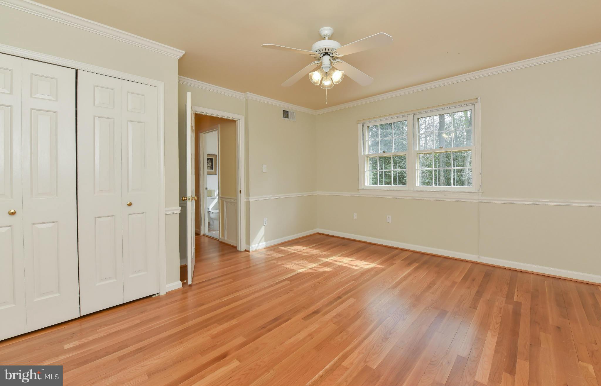 7704 Burford Drive McLean, VA 22102 - Photo 20 of 30 a view of an empty room with wooden floor and a window