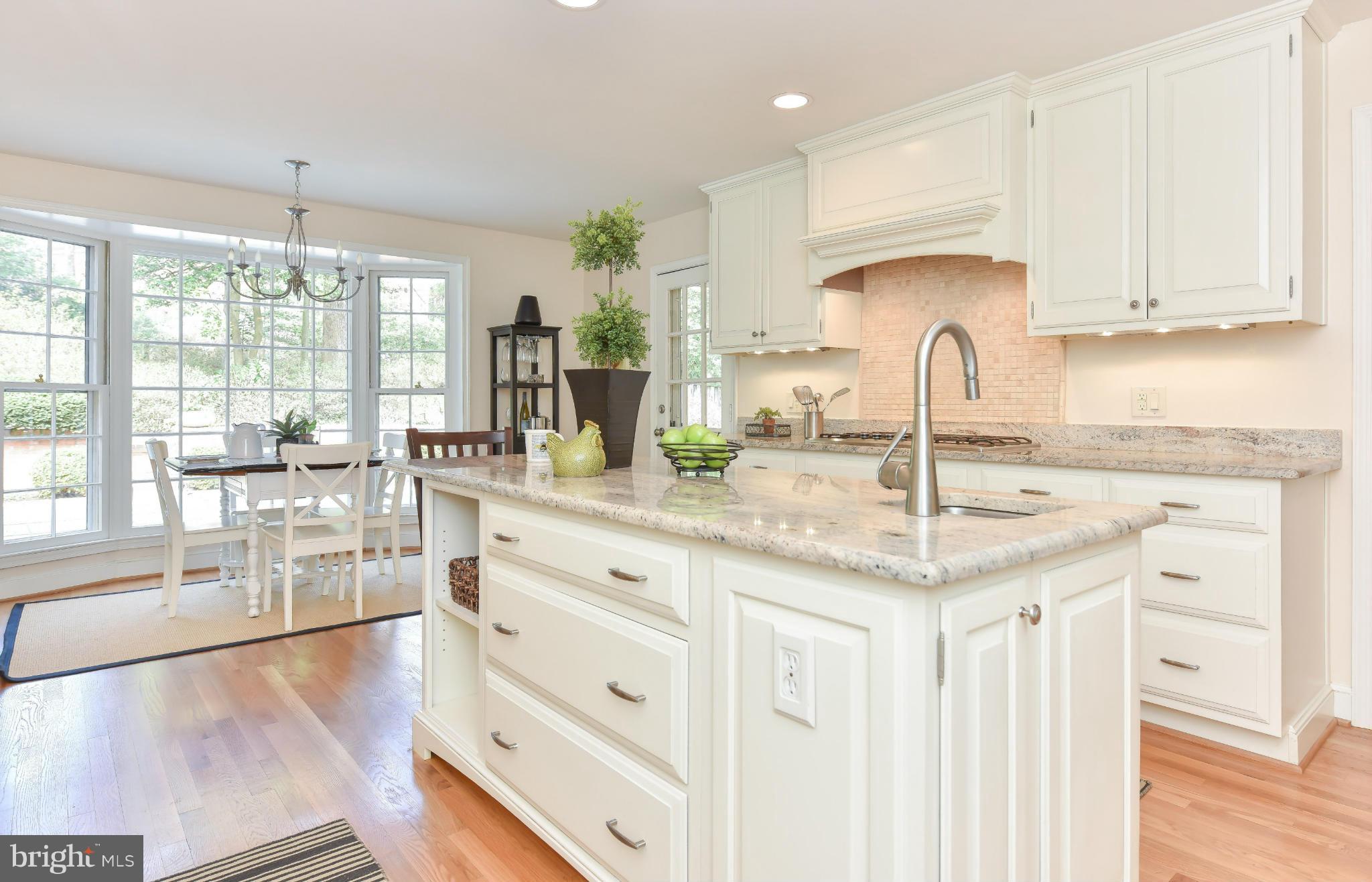 7704 Burford Drive McLean, VA 22102 - Photo 6 of 30 a kitchen with granite countertop a sink and cabinets
