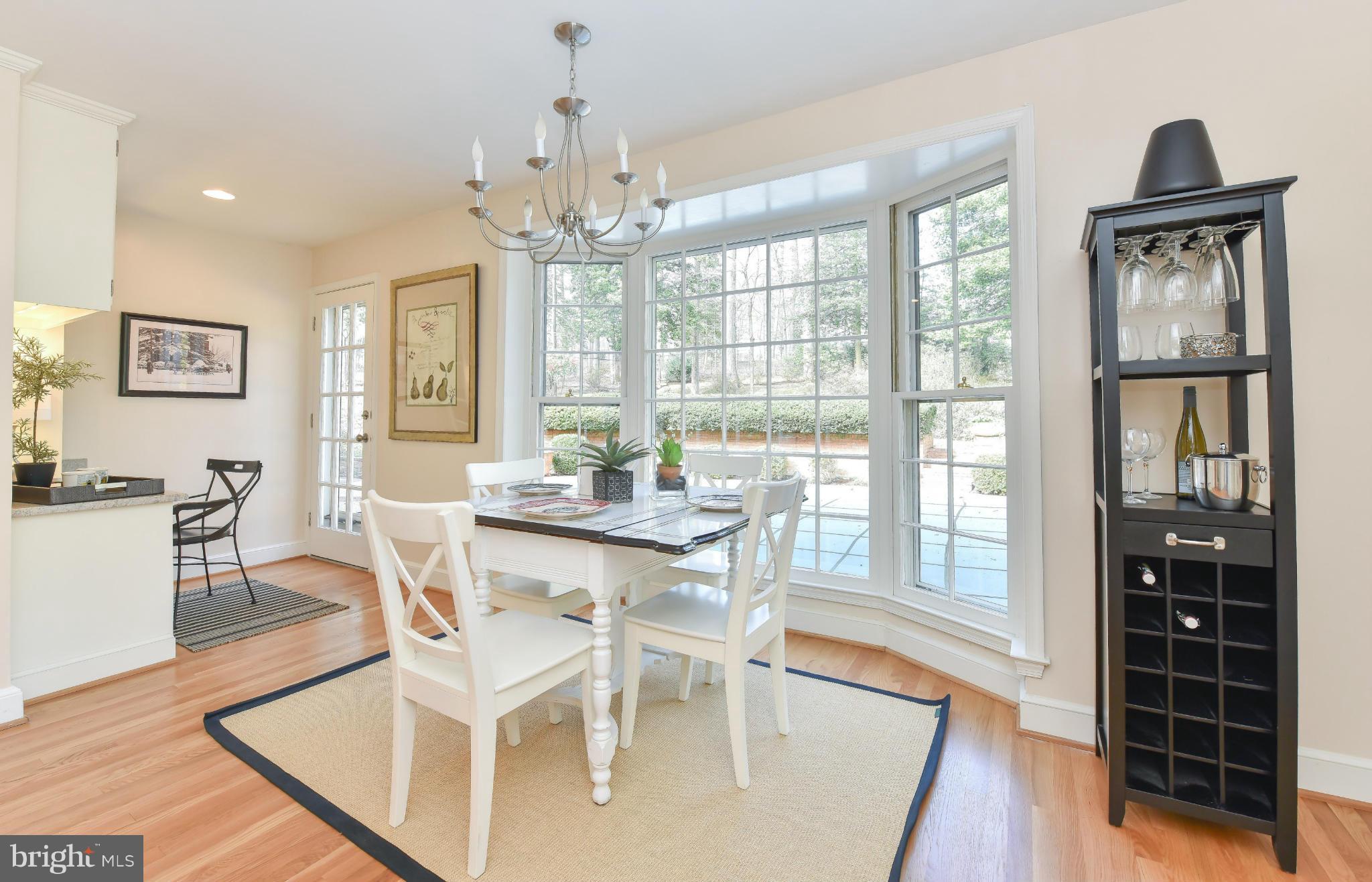 7704 Burford Drive McLean, VA 22102 - Photo 8 of 30 a view of a dining room with furniture window and wooden floor