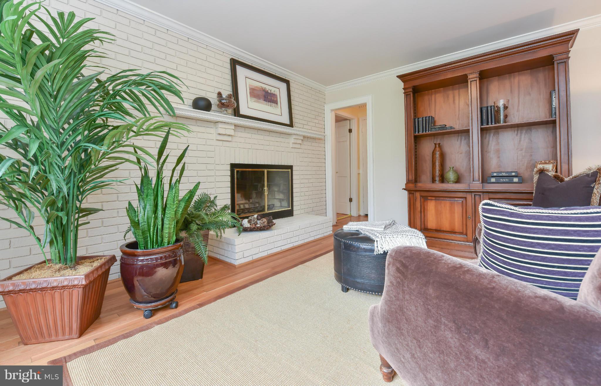 7704 Burford Drive McLean, VA 22102 - Photo 10 of 30 a living room with furniture a window and a potted plant