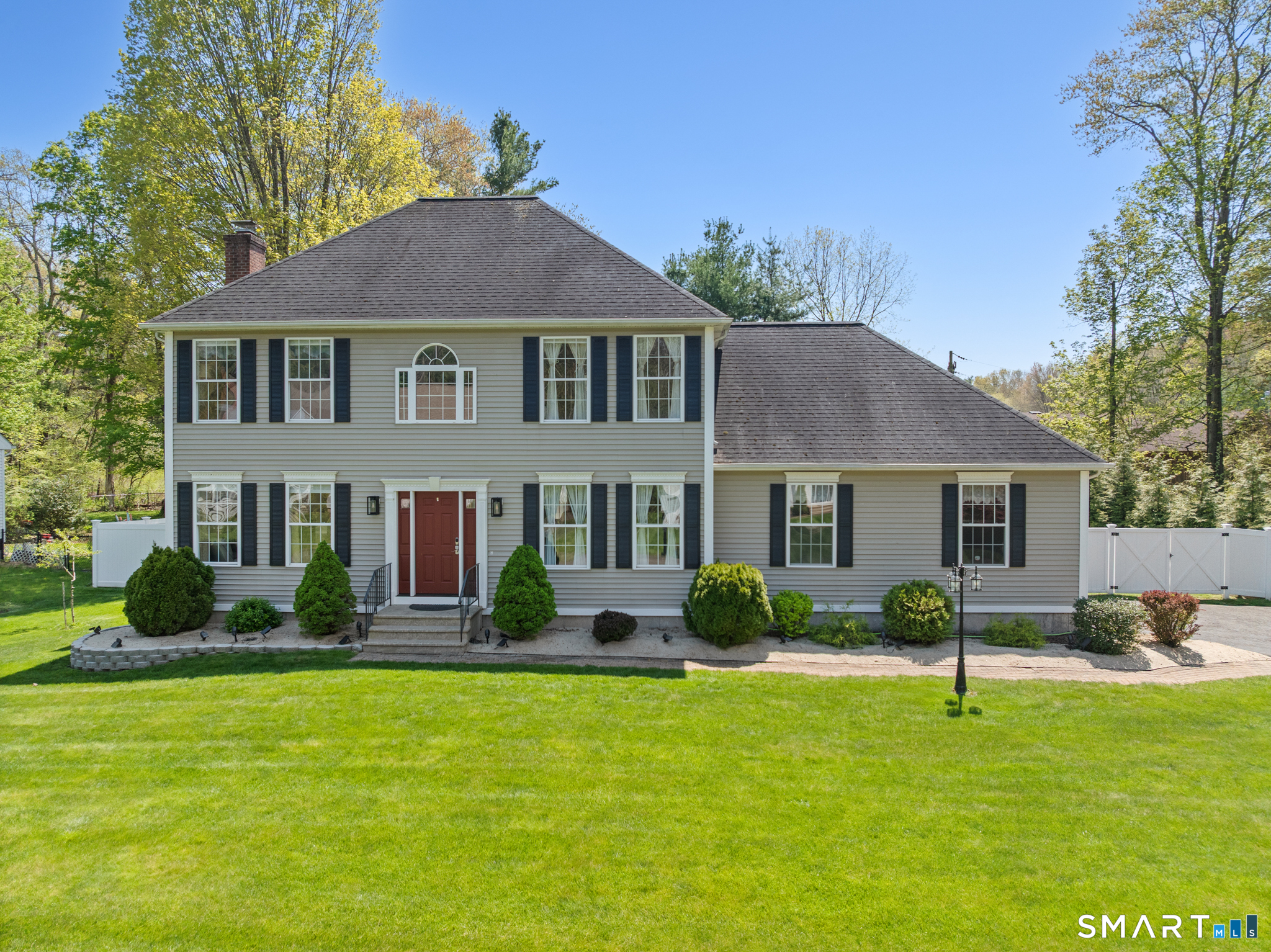 a front view of a house with a yard