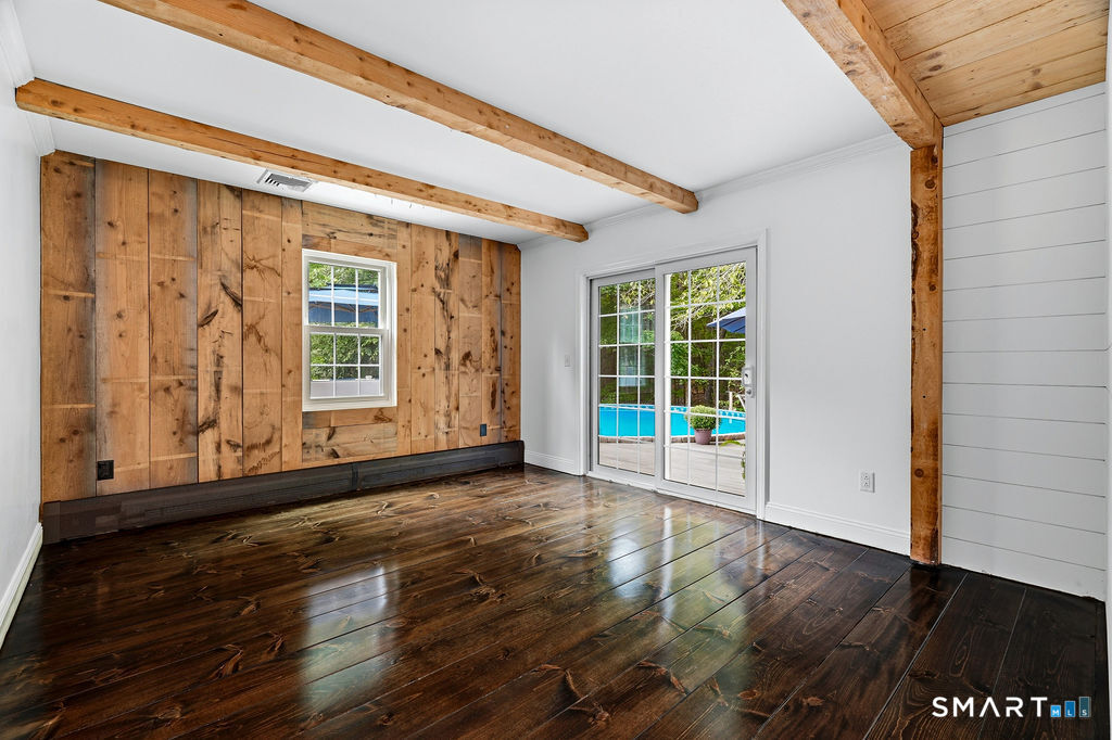 17 Florida Road East Haddam, CT 06423 - Photo 38 of 40 This home features a versatile floor plan. This room off the back of the house is perfect for a dining room, family room, TV room,...opening to the deck.