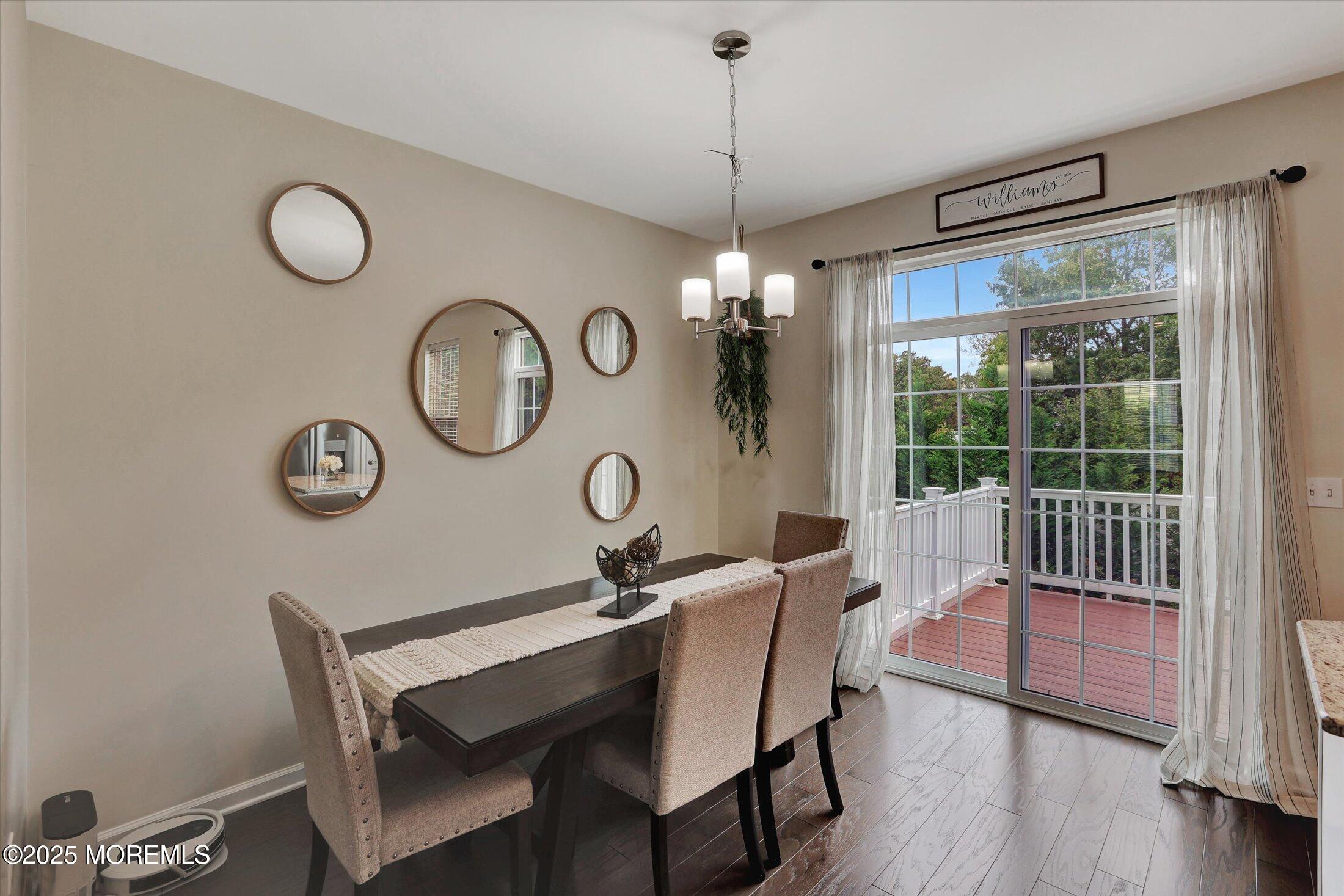303 Prosper Way, Unit 203 Brick, NJ 08723 - Photo 15 of 36 a view of a dining room with furniture clock and a large window