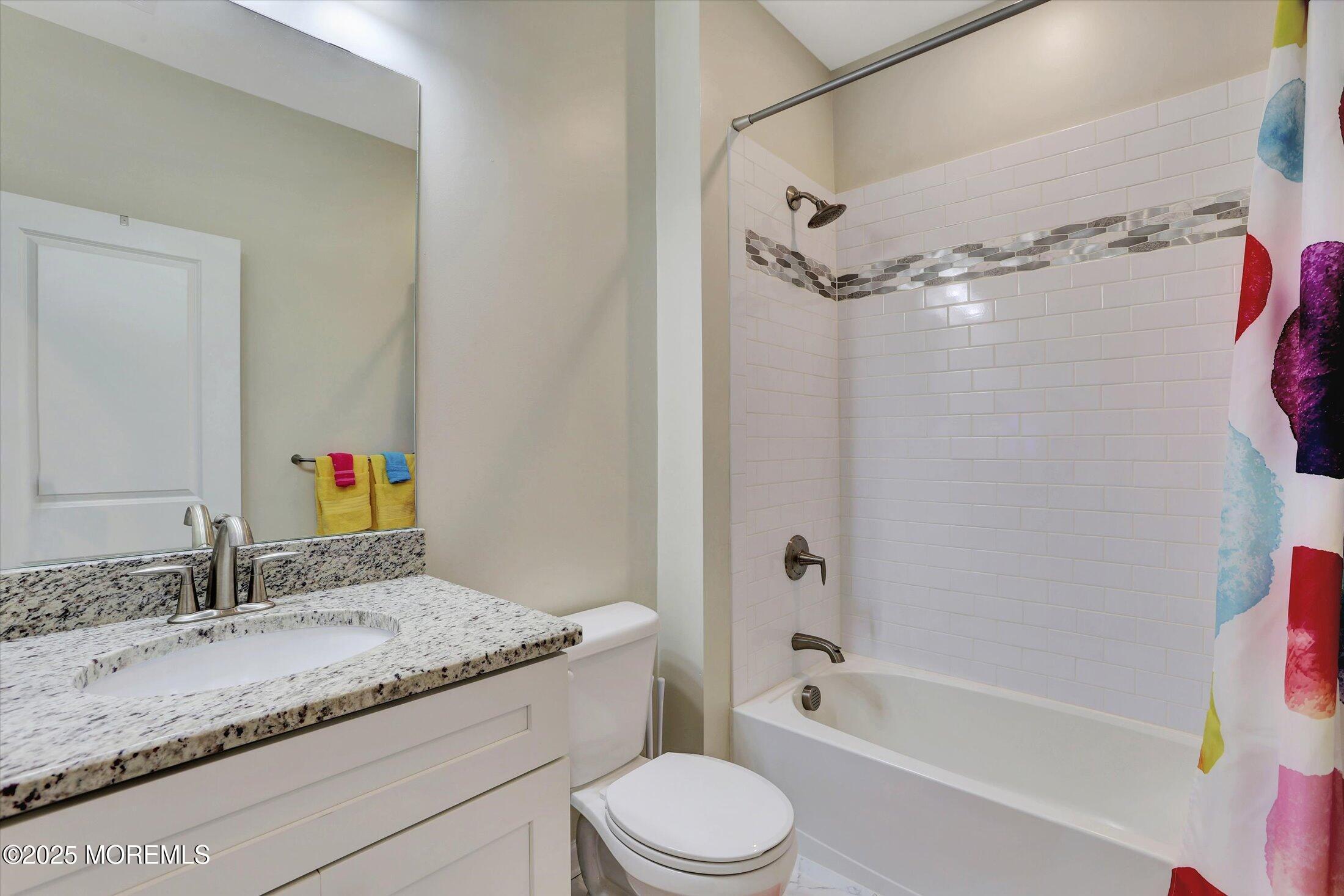 303 Prosper Way, Unit 203 Brick, NJ 08723 - Photo 17 of 36 a bathroom with a granite countertop sink toilet and shower