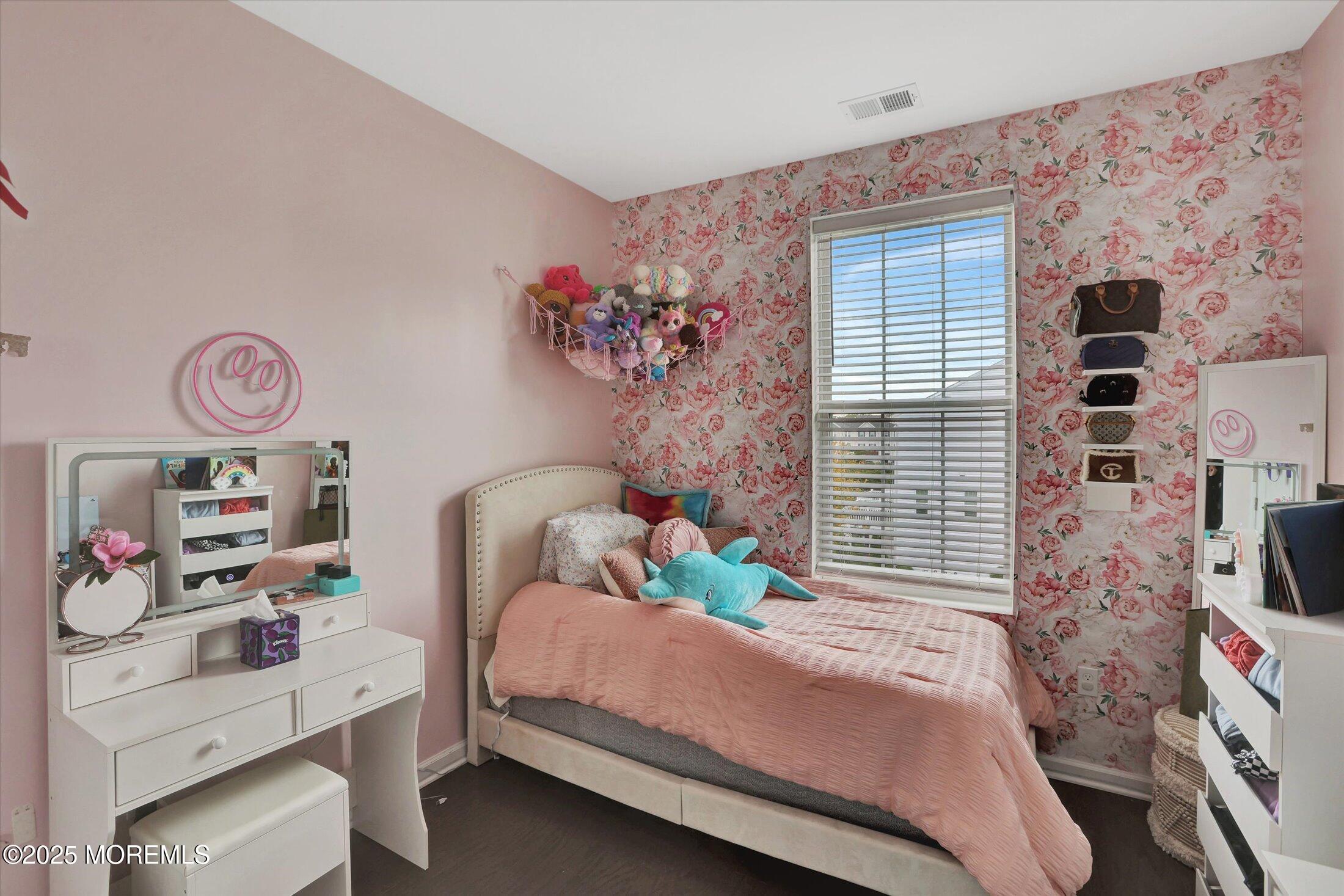 303 Prosper Way, Unit 203 Brick, NJ 08723 - Photo 18 of 36 a bedroom with a bed and a window