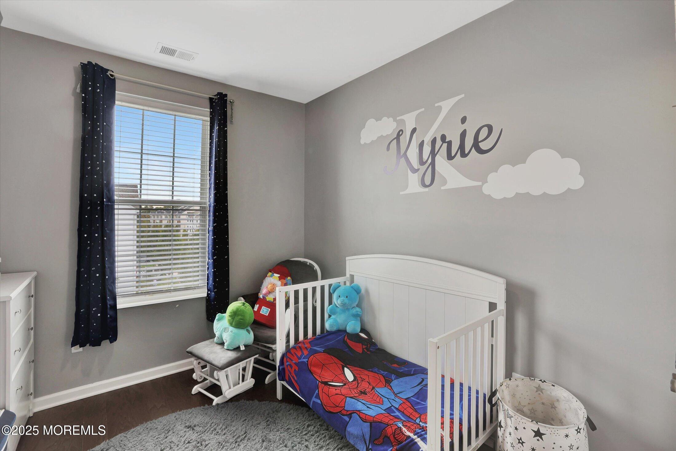 303 Prosper Way, Unit 203 Brick, NJ 08723 - Photo 19 of 36 a bedroom with a bed and toys
