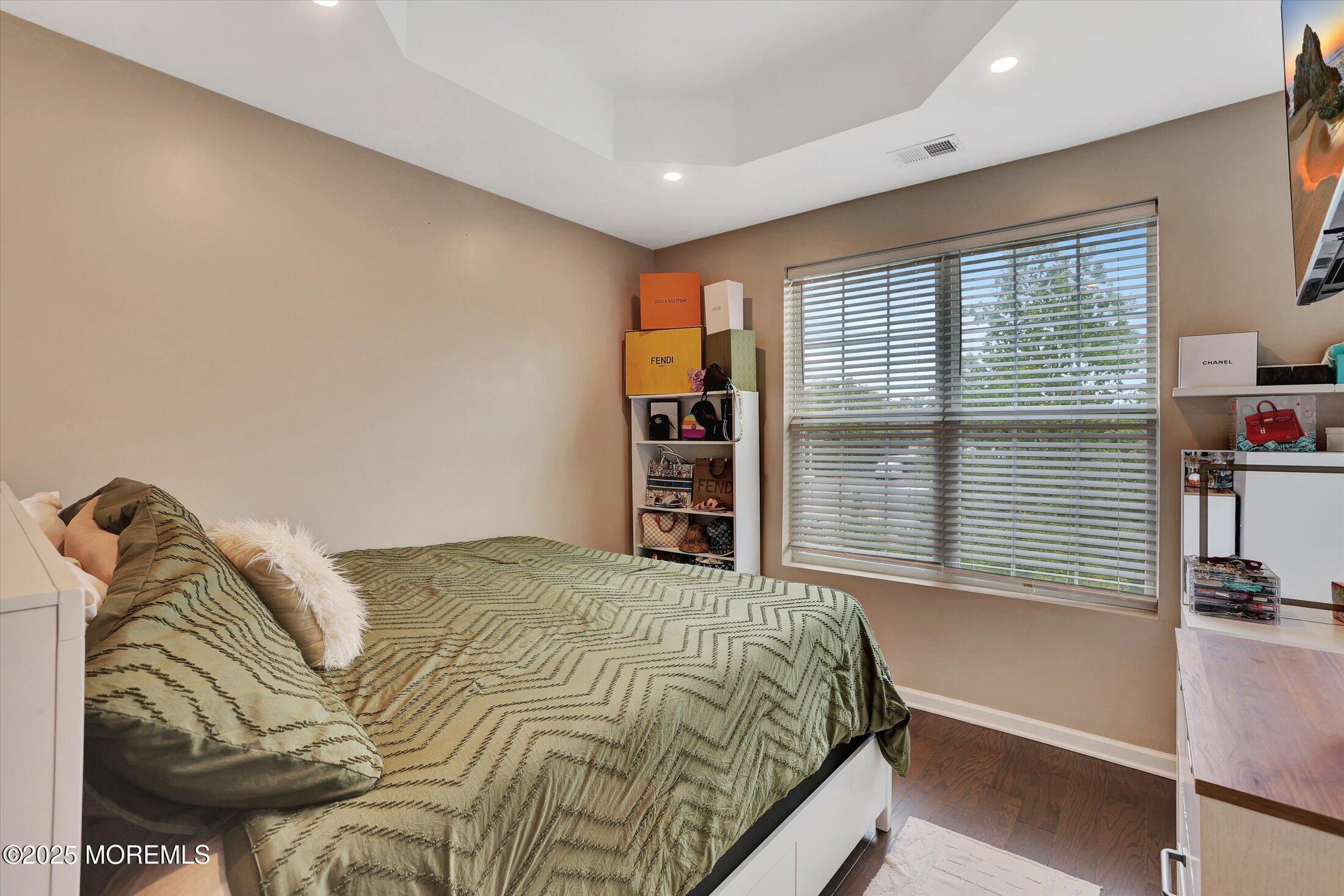 303 Prosper Way, Unit 203 Brick, NJ 08723 - Photo 20 of 36 a bedroom with a bed and a large window