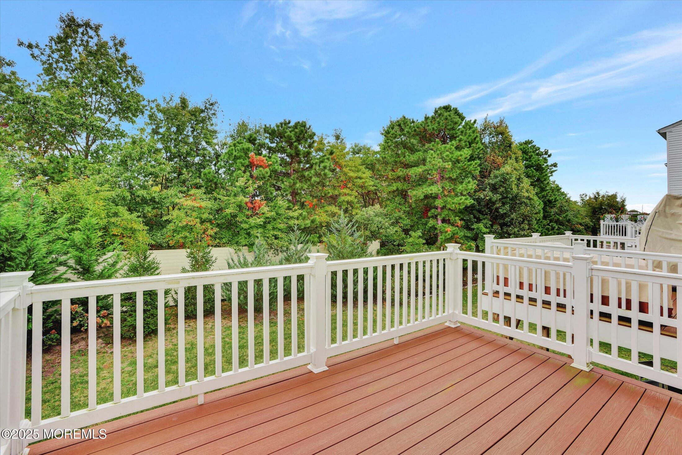 303 Prosper Way, Unit 203 Brick, NJ 08723 - Photo 25 of 36 a view of wooden deck and a yard